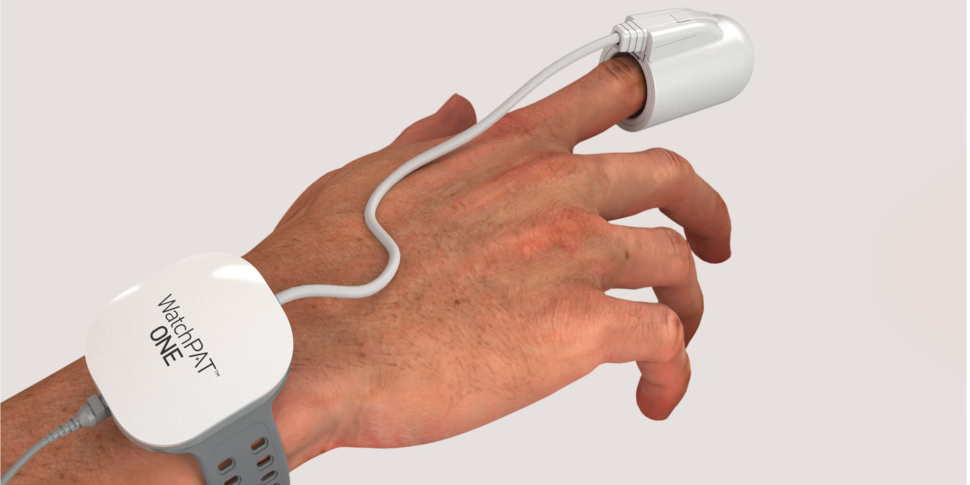 The hand and wrist of a person wearing the WatchPAT ONE home diagnostic sleep apnea test. A watch-like device is worn on the wrist, connected by a thin wire to a probe worn on the index finger.