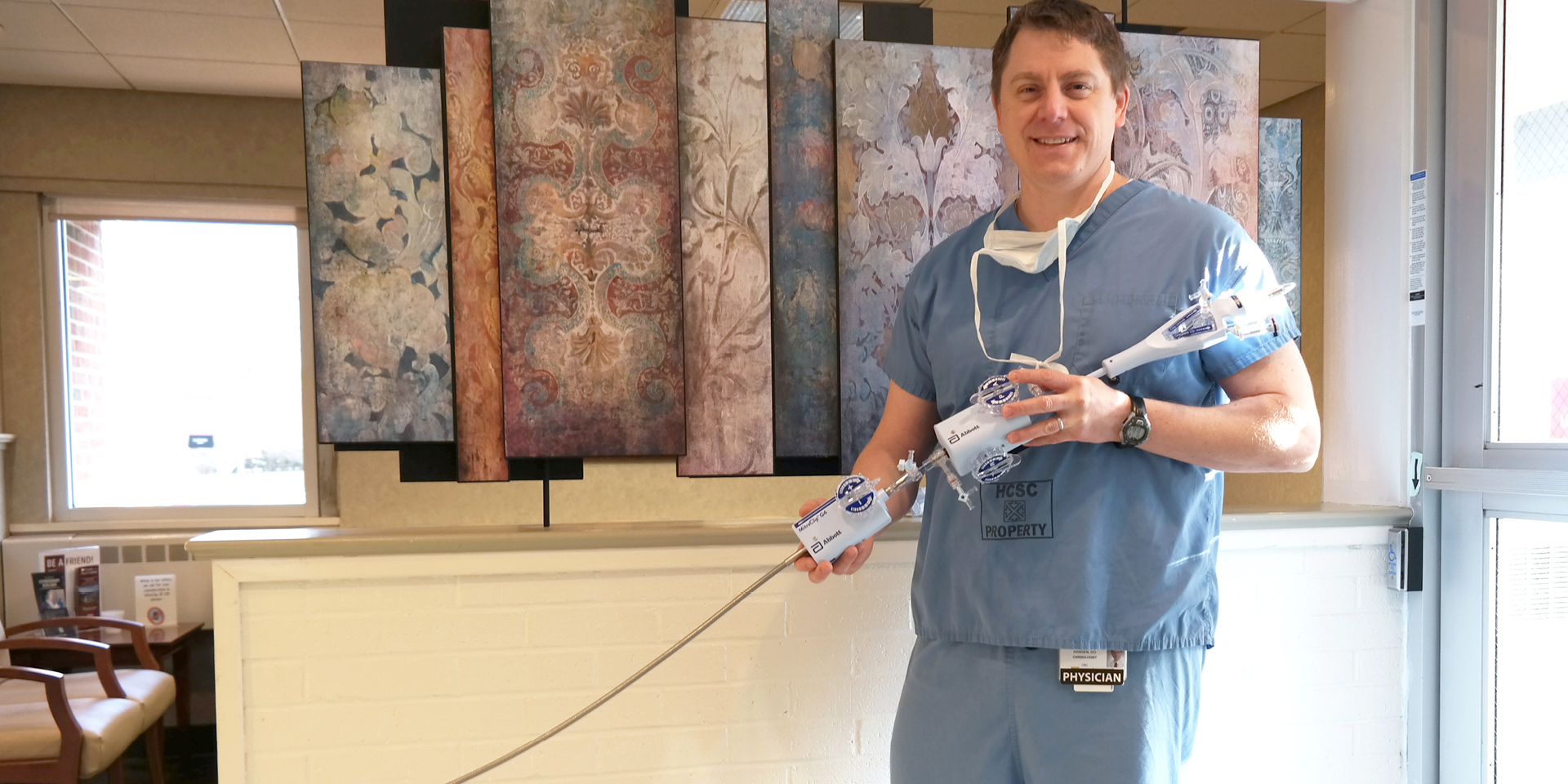 Dr. Hansen holding insertion device | Doylestown Health