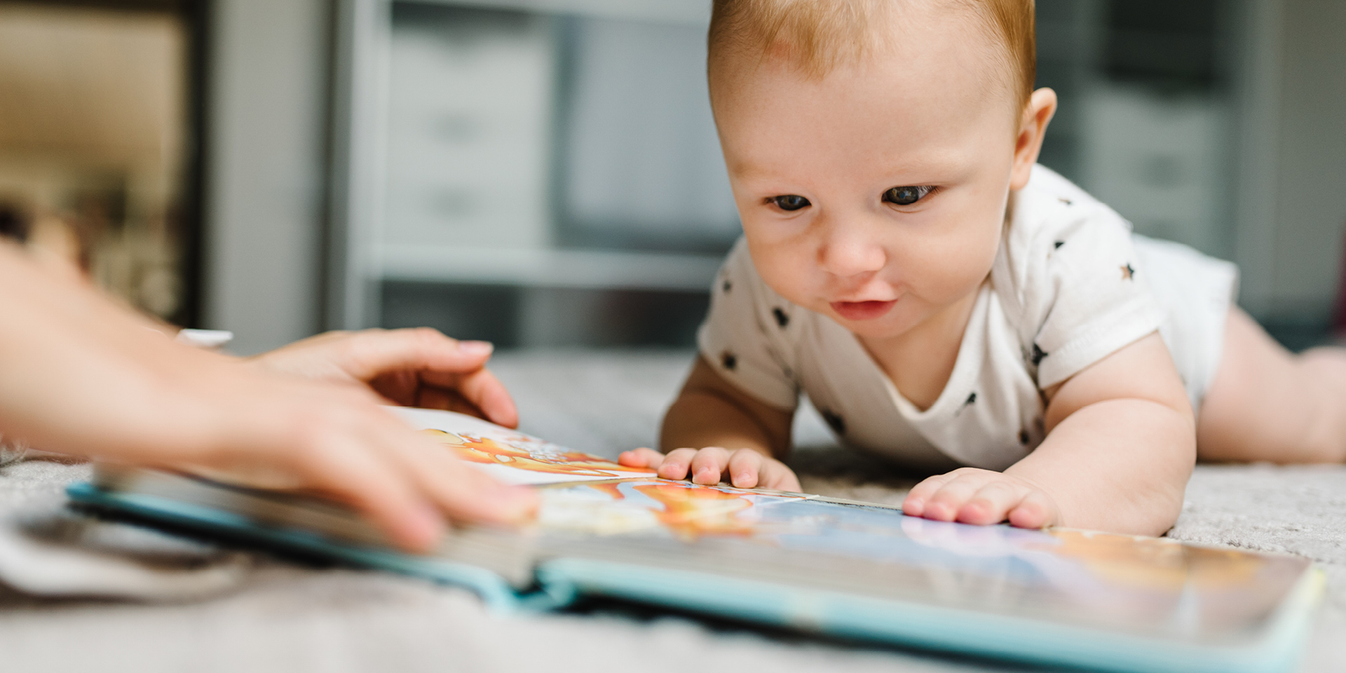 baby looking at a book