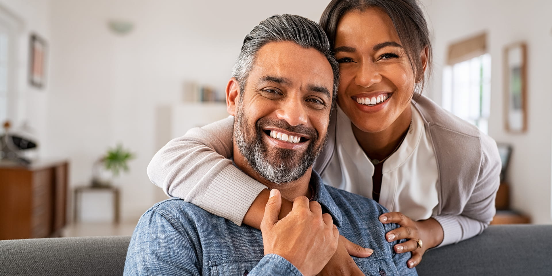 Wife with arm around her husband