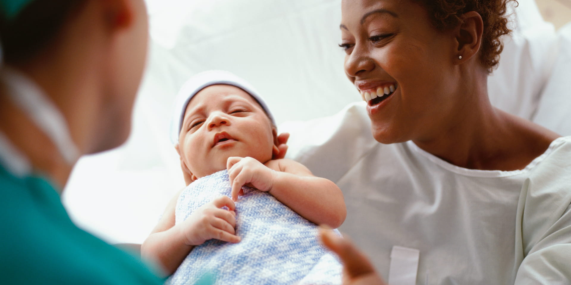 Mother holds newborn