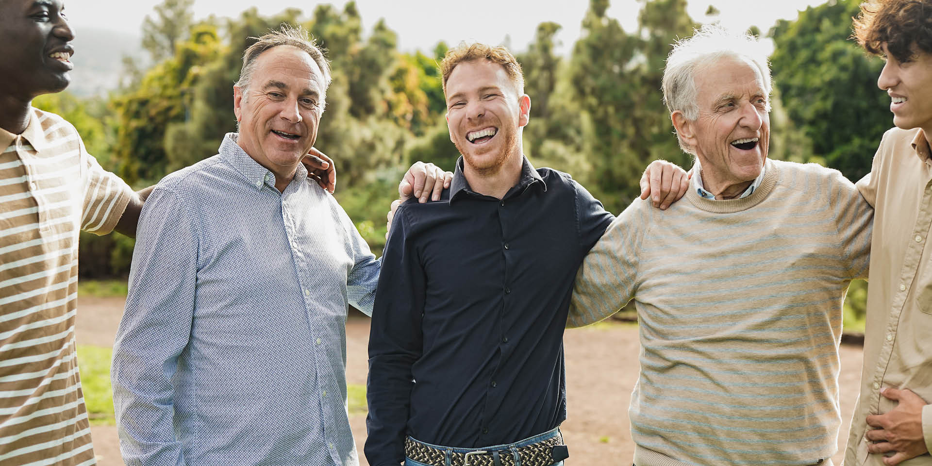 Men standing with their arms around each other. | Doylestown Health