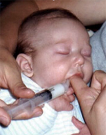 Mother finger feeding her baby | Doylestown Health
