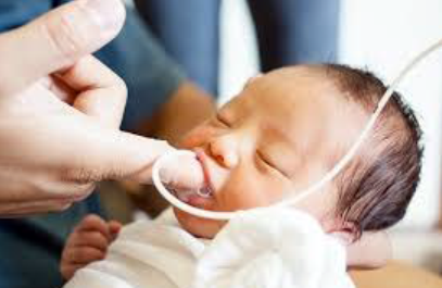 Mother finger feeding her baby | Doylestown Health