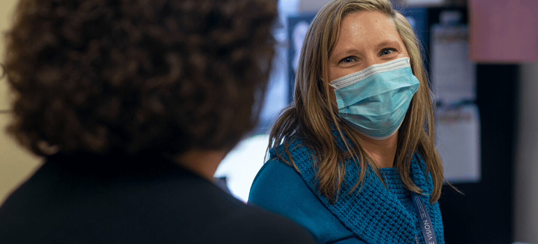 Women wearing a mask and smiling | Doylestown Health