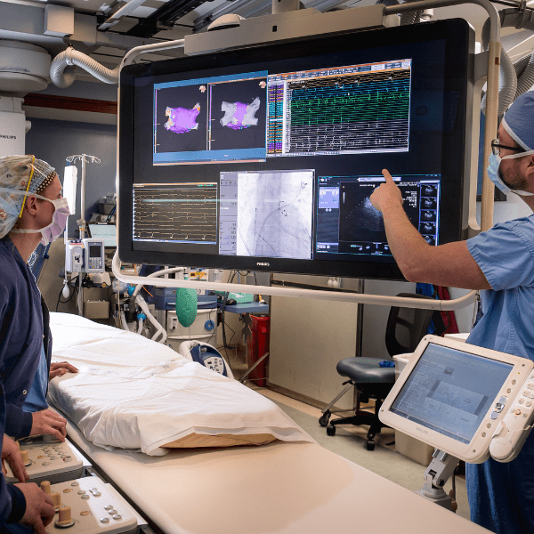 Providers inside an operating room discussing charts | Doylestown Health