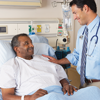 Provider with hand on patient's shoulder | Doylestown Health