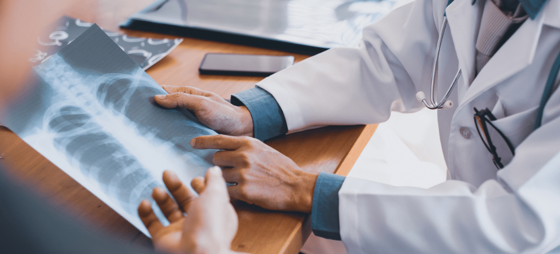 Provider reviewing an X-Ray with a patient | Doylestown Health